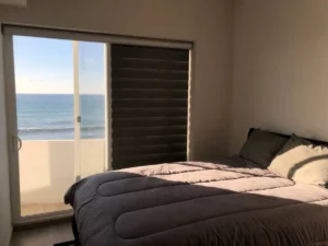 Look at the ocean while laying in bed